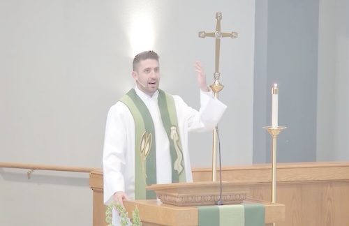 Pastor preaching from the pulpit at Faith Evangelical Lutheran Church
